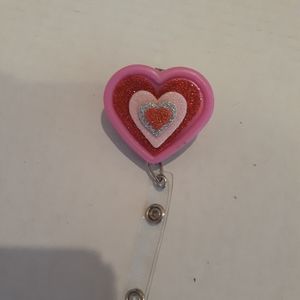 Retractable name badge holder